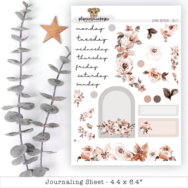 a white sheet with pink flowers and a star next to it