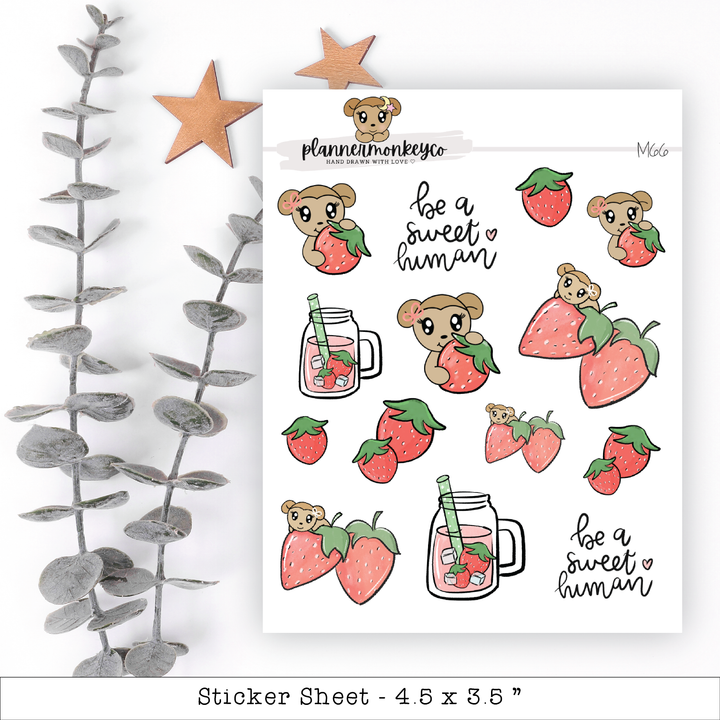 a sticker sheet with a bear and a strawberry