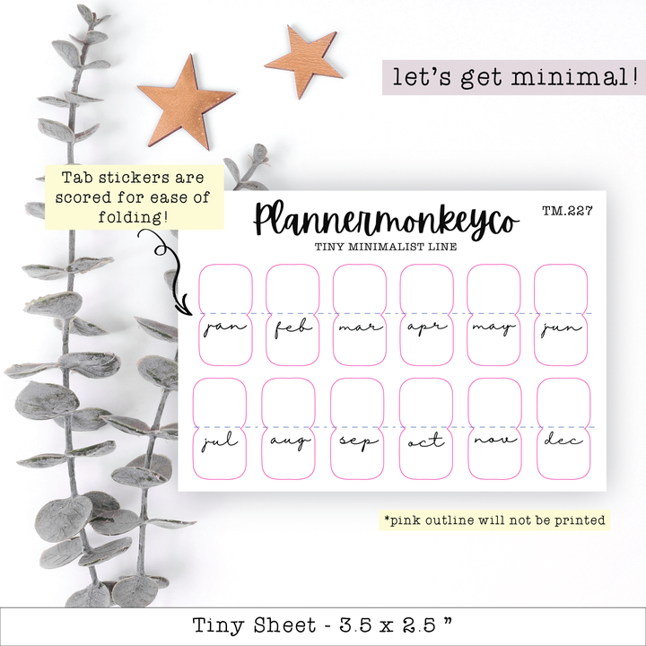 a planner sticker with a plant next to it