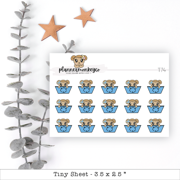 a sheet of stickers with a bear in a cup