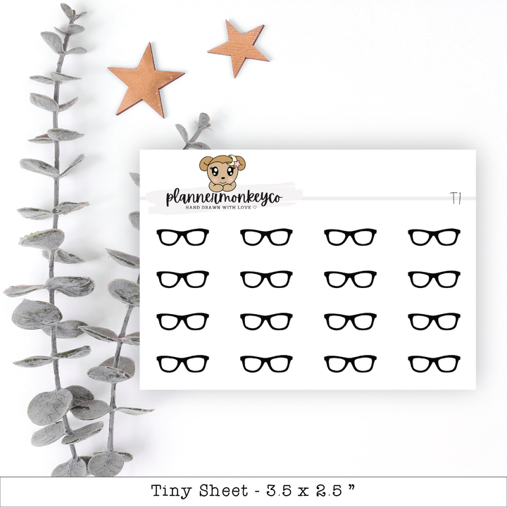 a sheet of paper with glasses and stars on it