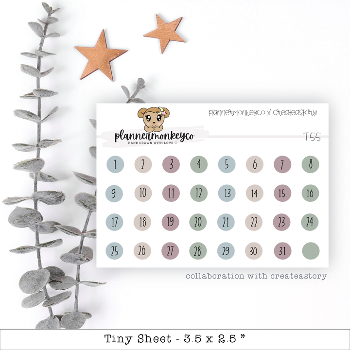 a calendar with a teddy bear sitting on top of it