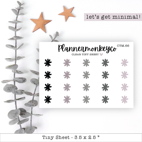 a sheet of paper with a plant and stars on it