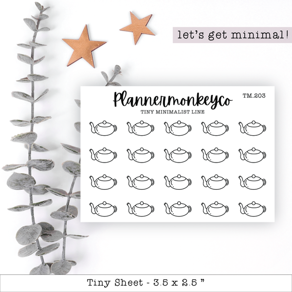 a planner sticker with teapots and stars on it