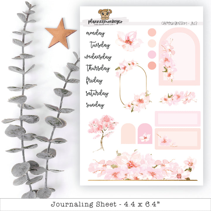 a pink floral sticker sheet next to a star