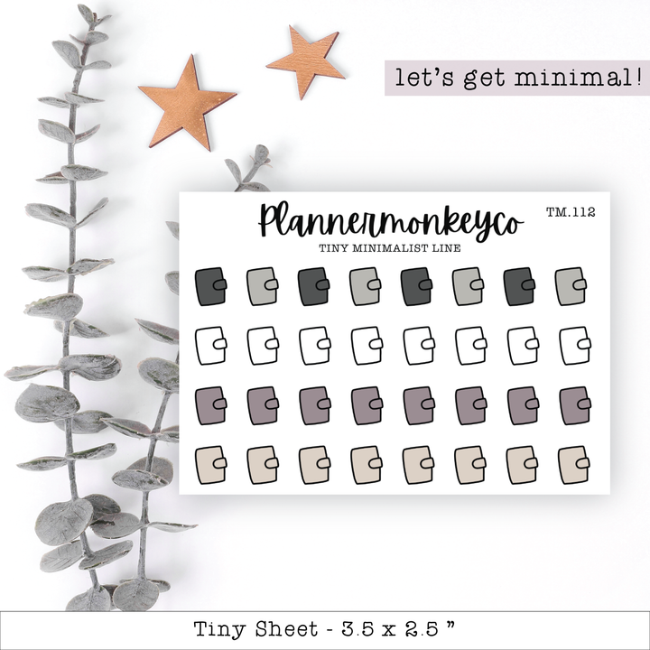 a planner sticker next to a plant