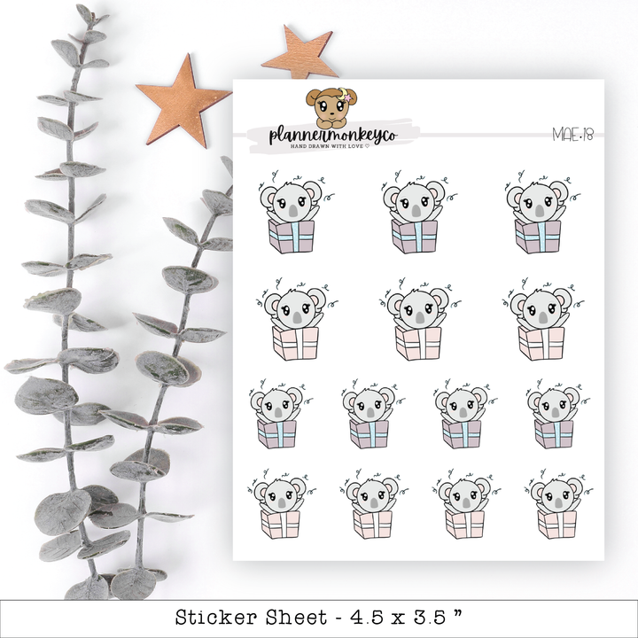 a sticker sheet with a picture of a koala bear in a gift box