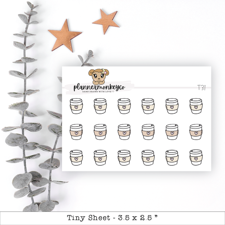 a planner sticker with coffee cups and a teddy bear