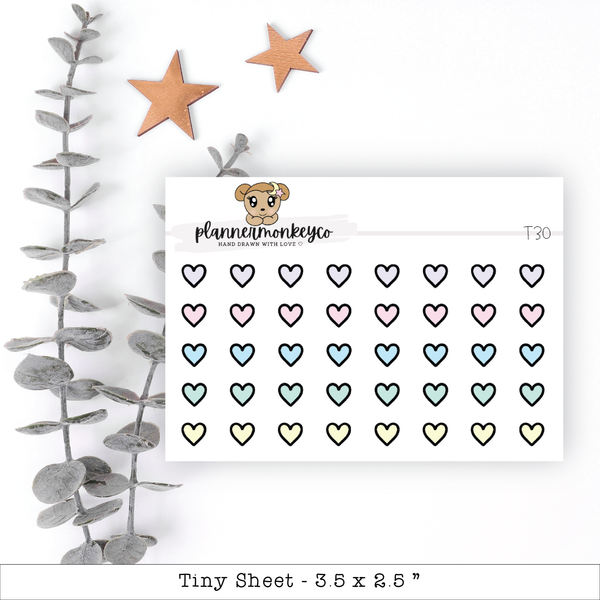 a planner sticker with hearts and a teddy bear