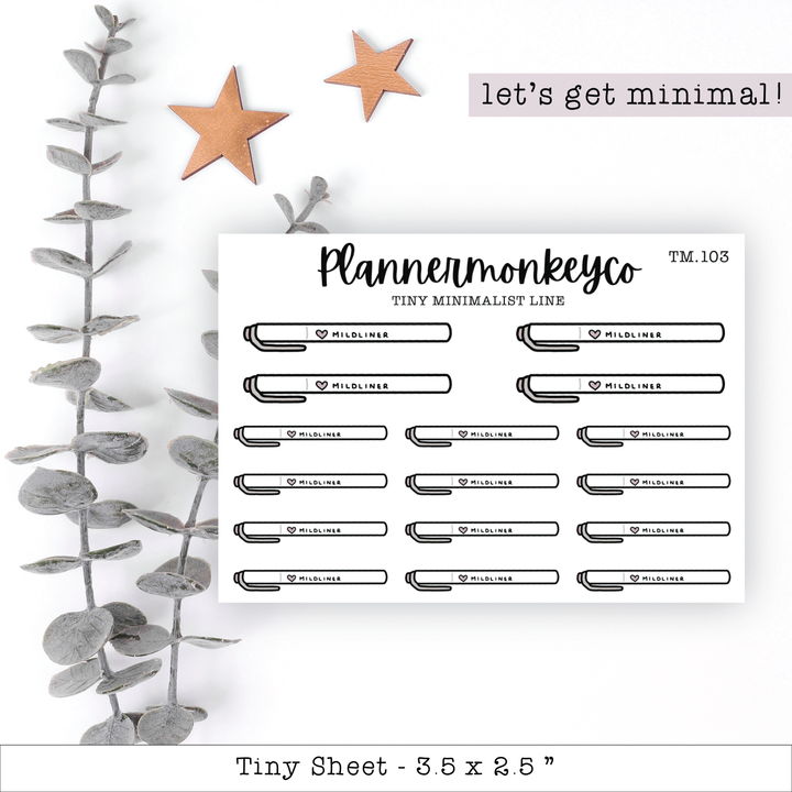 a planner sticker next to a plant