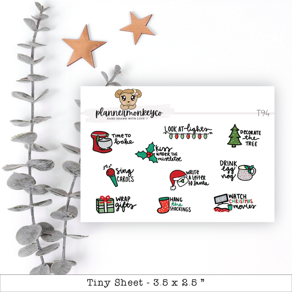 a white sheet of paper with christmas stickers on it