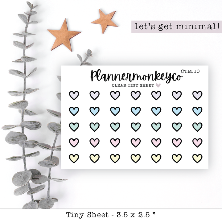 a sheet of paper with hearts and stars on it